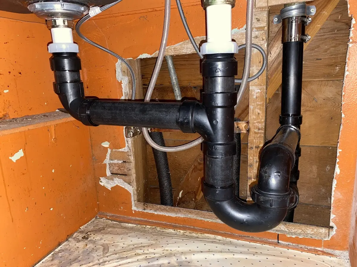 Professional Garbage Disposal Repair equipment and tools on the job in Oak Island